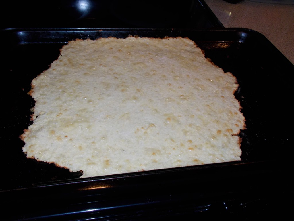 Prebaked crust should be a bit brown and bubbly. Note that used a smaller amount of ingredients in this pic. This recipe will fill your cookie sheet. 